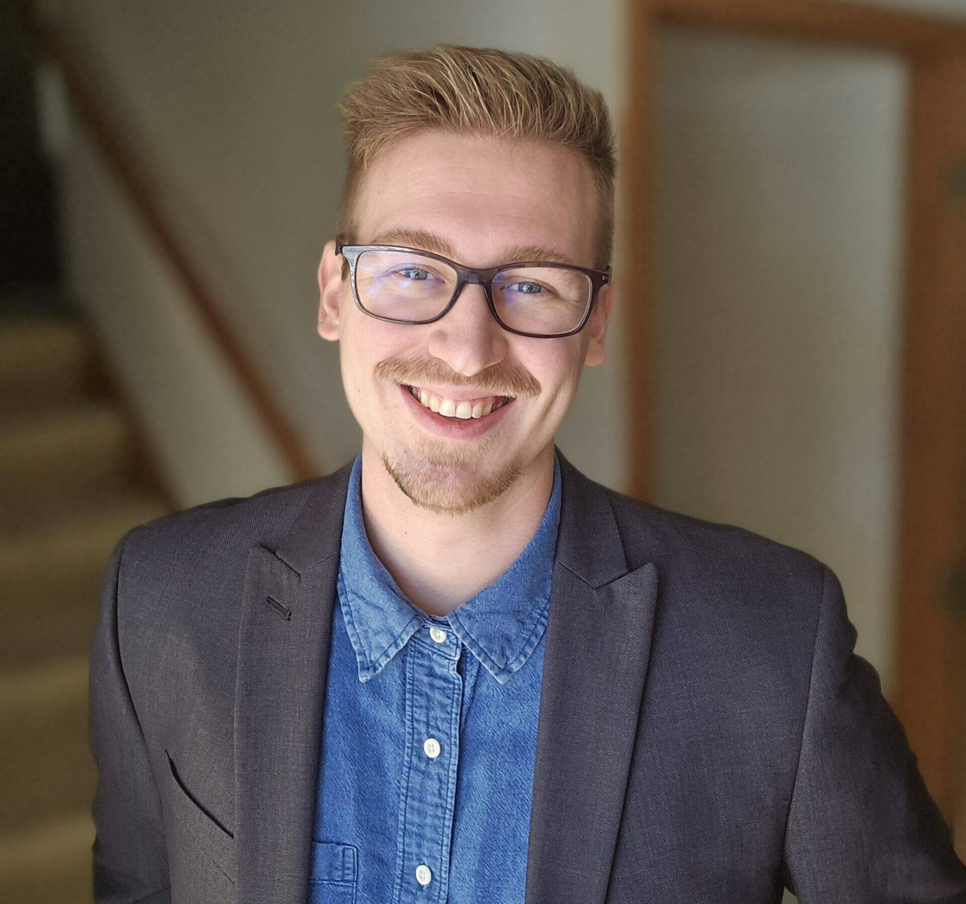 Professional headshot of a Mined XAI expert, embodying human-centered, explainable AI for enterprise decision-making.